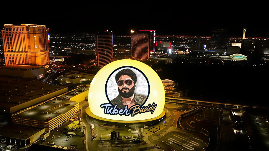 The Sphere in Las Vegas illuminated at night with a branded digital display, showcasing immersive LED technology and futuristic entertainment